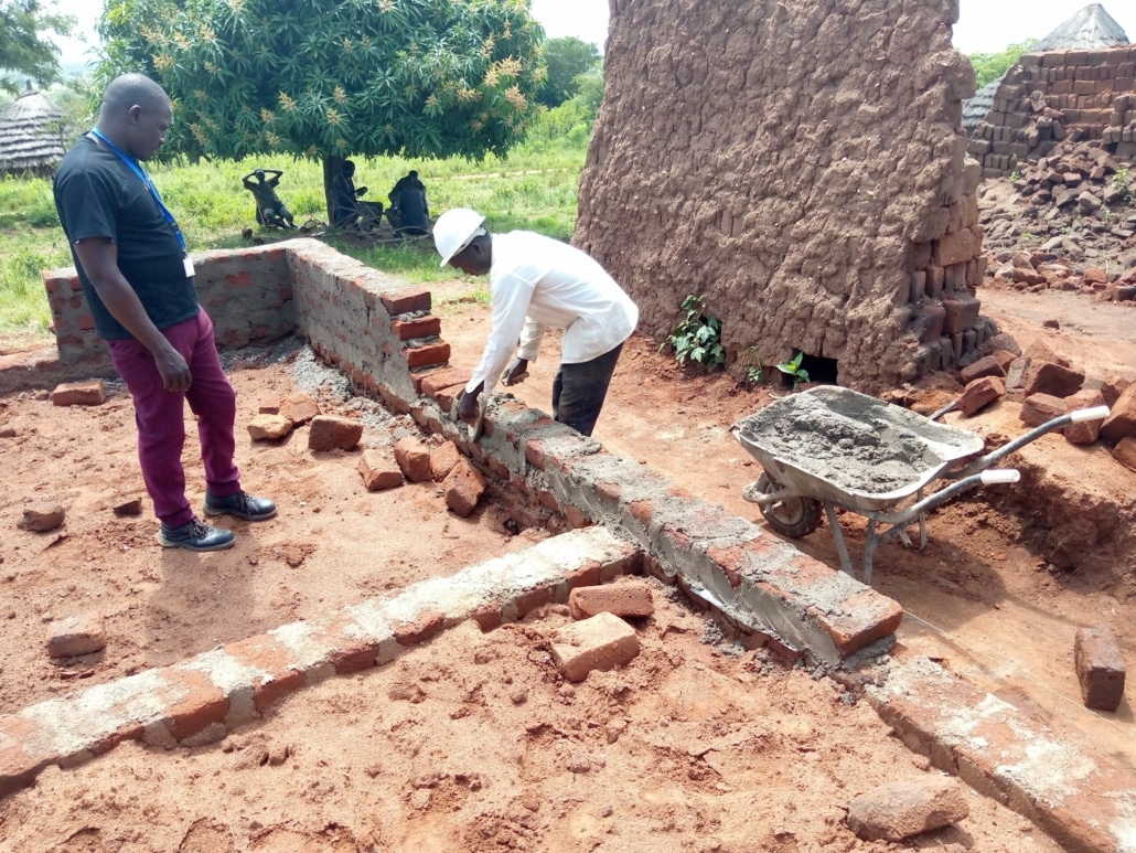 Logwee baniface on side working on three bedroom house